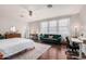 Bright bedroom features hardwood floors, modern fixtures, and a large ceiling fan at 9758 E Monterey Ave, Mesa, AZ 85209