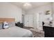 Bright bedroom featuring wood floors, natural light, ceiling fan, and neutral color palette at 9758 E Monterey Ave, Mesa, AZ 85209