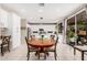 Bright kitchen with dining nook and sliding glass doors to the backyard patio at 9758 E Monterey Ave, Mesa, AZ 85209