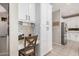 Bright kitchen with a workspace, white cabinets, granite countertops, and stainless appliances at 9758 E Monterey Ave, Mesa, AZ 85209