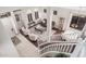 Open floor plan with view to formal living and dining area from the curved staircase at 9758 E Monterey Ave, Mesa, AZ 85209