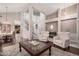 Spacious living room featuring high ceilings, a staircase, and lots of natural light at 9758 E Monterey Ave, Mesa, AZ 85209