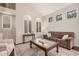 Light-filled living room showcases neutral tones, stylish decor, and modern window shutters at 9758 E Monterey Ave, Mesa, AZ 85209