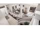An overhead view of a traditionally decorated living room with carpet, hardwood, and tile flooring at 9758 E Monterey Ave, Mesa, AZ 85209