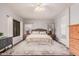 Bright primary bedroom features hardwood floors and neutral decor at 9758 E Monterey Ave, Mesa, AZ 85209