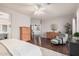 Generous primary bedroom featuring hardwood floors, ample lighting, and a sitting area at 9758 E Monterey Ave, Mesa, AZ 85209