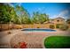 Secluded backyard pool offers a private oasis surrounded by beautiful landscaping and mature trees at 9758 E Monterey Ave, Mesa, AZ 85209