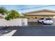 A covered parking area sits next to this townhome, with a desert-friendly landscape at 10547 W Coggins Dr, Sun City, AZ 85351