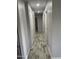 Hallway features freshly painted walls, neutral paint and wood-look tile floors, and recessed lighting at 1132 E 9Th Pl, Casa Grande, AZ 85122