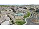 Drone shot of the residential community with a pool and common area in a manicured landscape at 1255 N Arizona Ave # 1043, Chandler, AZ 85225