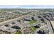 Community aerial view showing lush landscaping, pool, homes, and a scenic mountain backdrop at 1255 N Arizona Ave # 1043, Chandler, AZ 85225