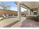 Covered patio features an outdoor lounge and meticulously landscaped backyard at 1255 N Arizona Ave # 1043, Chandler, AZ 85225
