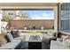 Relaxing covered back patio with an outdoor seating area, a fire pit, and backyard views at 1255 N Arizona Ave # 1043, Chandler, AZ 85225