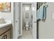 Well-lit bathroom featuring neutral tile flooring, a white toilet, a single window, and modern fixtures at 1255 N Arizona Ave # 1043, Chandler, AZ 85225