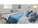 Cozy bedroom featuring a plush bed with soft bedding, a window with blinds, and neutral-toned walls at 1255 N Arizona Ave # 1043, Chandler, AZ 85225