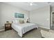 Cozy bedroom featuring neutral tones, soft carpet, comfortable queen bed, ceiling fan, and ample natural light at 1255 N Arizona Ave # 1043, Chandler, AZ 85225
