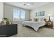 Bedroom with a queen bed, ceiling fan and bright windows that create a relaxing and inviting atmosphere at 1255 N Arizona Ave # 1043, Chandler, AZ 85225