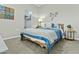 Comfortable bedroom with plush carpet, accent wall decor, side tables, and a peek into the walk-in closet at 1255 N Arizona Ave # 1043, Chandler, AZ 85225