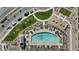 Aerial shot featuring a luxurious community pool, lounge chairs, and ample green space at 1255 N Arizona Ave # 1043, Chandler, AZ 85225