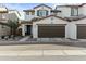 Inviting two-story home featuring a two-car garage and manicured front yard landscaping at 1255 N Arizona Ave # 1043, Chandler, AZ 85225