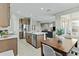 Open concept kitchen with a center island seamlessly connects to the dining area at 1255 N Arizona Ave # 1043, Chandler, AZ 85225