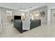 Bright living room featuring tile floors, a ceiling fan, a sliding glass door, and modern decor at 1255 N Arizona Ave # 1043, Chandler, AZ 85225
