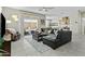 Bright living room boasts tile floors, modern furniture, and seamless access to the outdoor patio at 1255 N Arizona Ave # 1043, Chandler, AZ 85225