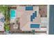 Top-down aerial view featuring a sparkling pool, patio, pergola, and solar panels at 12910 W Tuckey Ln, Glendale, AZ 85307