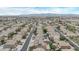 Beautiful aerial shot showcasing homes with pools and green space in a neighborhood with mountain views in the background at 12910 W Tuckey Ln, Glendale, AZ 85307