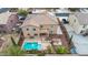 Backyard featuring a refreshing swimming pool, covered patio, and desert-friendly landscaping at 12910 W Tuckey Ln, Glendale, AZ 85307