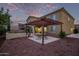 Expansive backyard featuring a pergola with outdoor seating at 12910 W Tuckey Ln, Glendale, AZ 85307