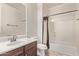Traditional bathroom featuring a vanity, toilet, and shower/tub combo at 12910 W Tuckey Ln, Glendale, AZ 85307