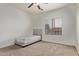 Neutral bedroom featuring a twin bed, window, and carpeted floors at 12910 W Tuckey Ln, Glendale, AZ 85307