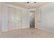 Neutral bedroom with double closet and carpeted floors at 12910 W Tuckey Ln, Glendale, AZ 85307