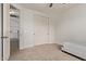 Neutral bedroom featuring a twin bed, closet, and carpeted floors at 12910 W Tuckey Ln, Glendale, AZ 85307