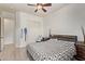 This bedroom features a ceiling fan, closet, and neutral color palette that creates a calm, inviting atmosphere at 12910 W Tuckey Ln, Glendale, AZ 85307