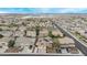 Neighborhood view featuring two-story home with solar panels, desert landscaping, and spacious driveways at 12910 W Tuckey Ln, Glendale, AZ 85307