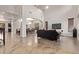 Open concept living room has soaring ceilings, with direct access to the dining room at 12910 W Tuckey Ln, Glendale, AZ 85307