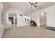 Open floorplan living room showcasing wood-look floors and arched doorway to the kitchen at 12910 W Tuckey Ln, Glendale, AZ 85307
