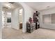 Bright loft space featuring an arched entryway leading to a bathroom, with elegant dark wood furniture at 12910 W Tuckey Ln, Glendale, AZ 85307