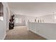 Bright, spacious loft area with neutral colors and arched architectural details at 12910 W Tuckey Ln, Glendale, AZ 85307