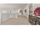 Spacious loft with white walls, arched doorways, and unique display furniture at 12910 W Tuckey Ln, Glendale, AZ 85307