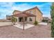 Charming backyard with a pergola-covered patio, manicured landscaping and relaxing outdoor space at 12910 W Tuckey Ln, Glendale, AZ 85307