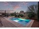 Inviting pool area with desert landscaping and a pergola in the distance at 12910 W Tuckey Ln, Glendale, AZ 85307
