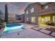 Expansive backyard with a shimmering pool, patio, and relaxing swing at 12910 W Tuckey Ln, Glendale, AZ 85307