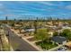 Spacious neighborhood with a view of the Phoenix skyline, palm trees, and green spaces at 1326 E Almeria Rd, Phoenix, AZ 85006