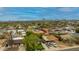 Picturesque aerial view showcasing a sprawling neighborhood with mountain views, blue skies and unique, colorful homes at 1326 E Almeria Rd, Phoenix, AZ 85006