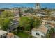 A vibrant cityscape view featuring diverse architecture, lush trees, and clear roads showcasing the urban setting at 1326 E Almeria Rd, Phoenix, AZ 85006