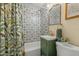 Stylish bathroom features patterned tile shower and a modern green vanity cabinet at 1326 E Almeria Rd, Phoenix, AZ 85006