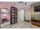 Eclectic pink bedroom featuring a full wall mirror, black bookshelf, and wood accents at 1326 E Almeria Rd, Phoenix, AZ 85006